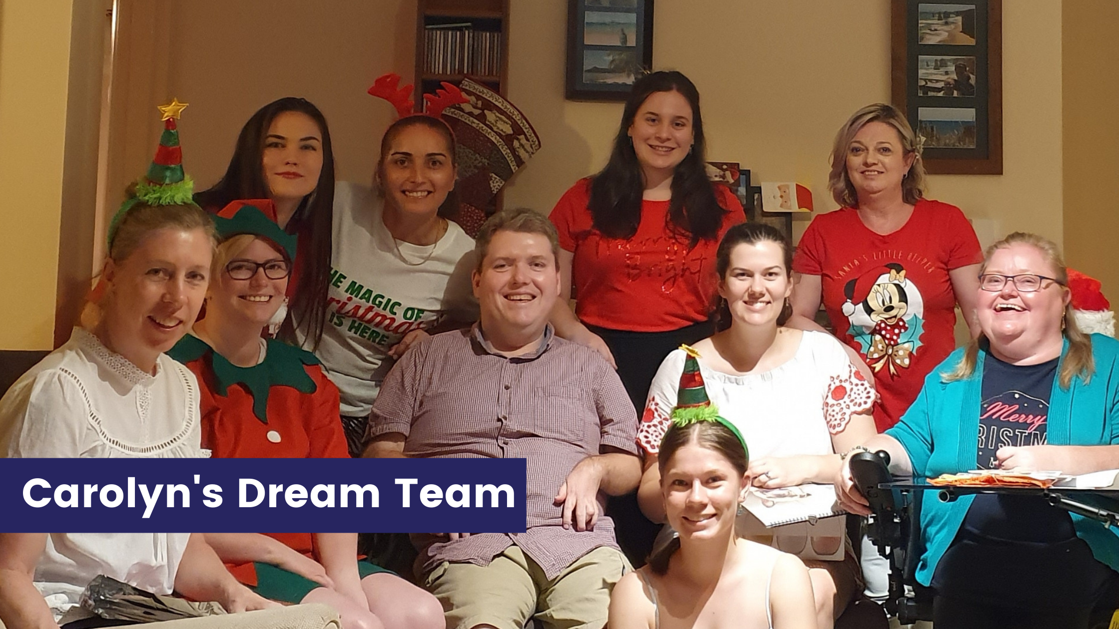 Carolyns  Dream Team - Carolyn and her partner surrounded by 8 people in Christmas costumes