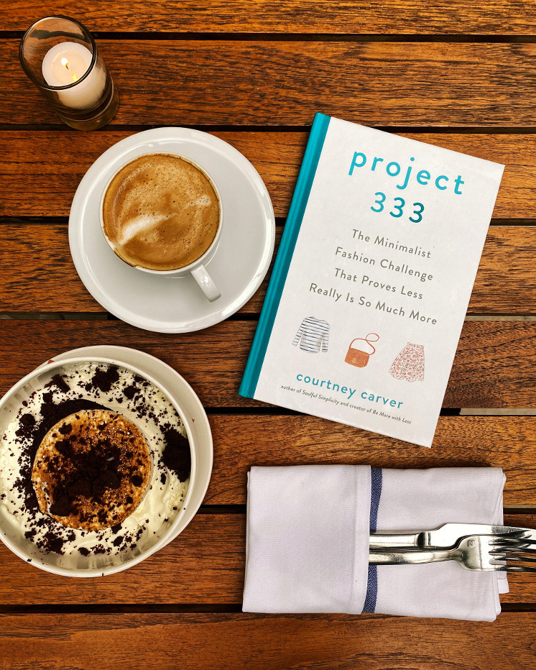 Project 333 Book Flatlay with Coffee, cake candle and cutlery