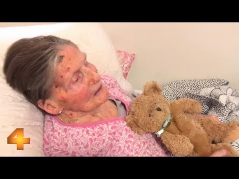 Elderly lady laying in bed