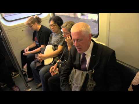 4 people sitting on a train