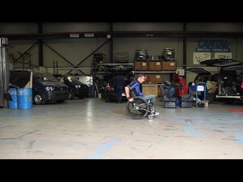Man in a wheelchair in a workshop
