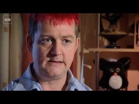 Man with red hair sitting and talking