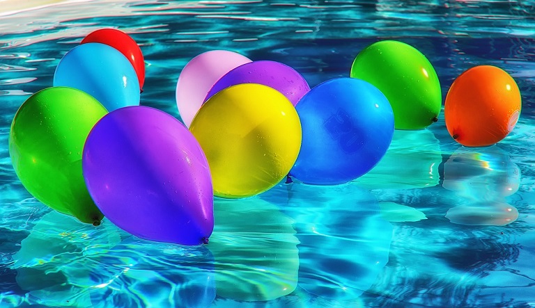 Coloured Balloons in a Swimming Pool
